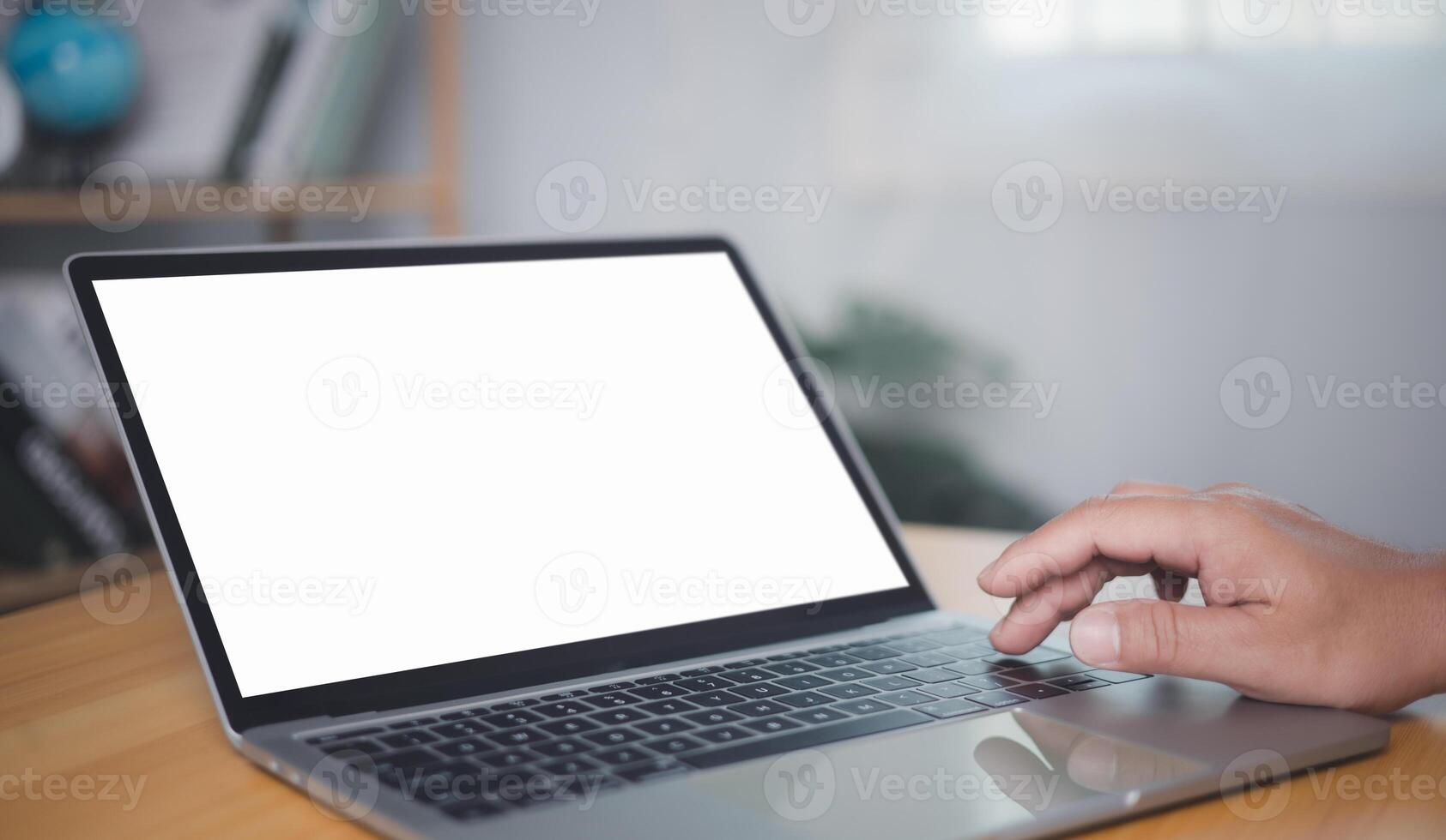 Blank screen laptop with white background for advertising text, Human hand use tablet and looking at it, Man using laptop contact business search information, Marketing and creative design. photo