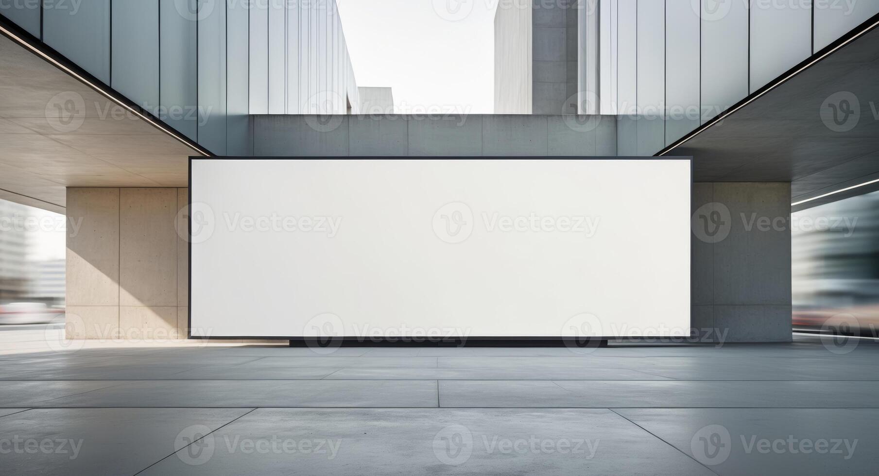Dynamic blank billboard display on modern building exterior in urban setting captured from ground level photo