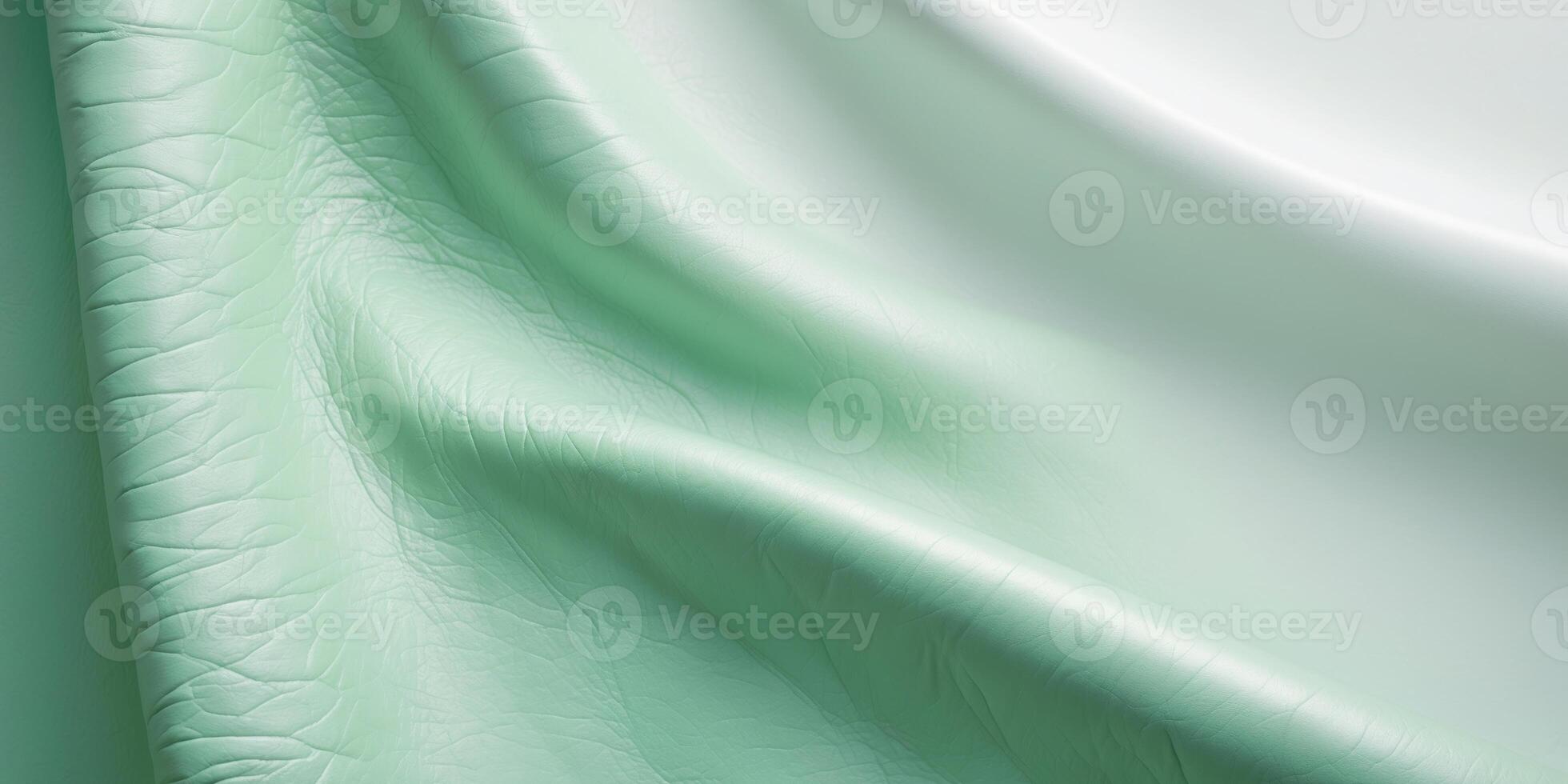 Mint green leather texture with subtle wrinkles and light gradient for backgrounds or designs photo