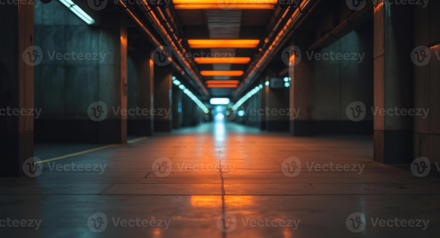 A subway station with orange lights and a dark background photo