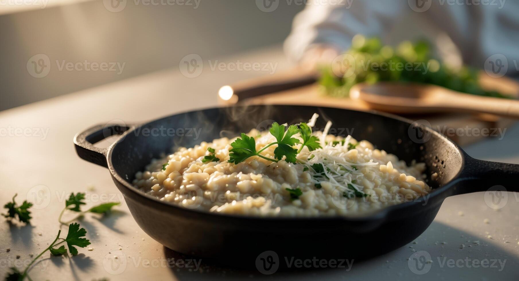 Close up view of a delicious risotto in a black pan ready to serve photo