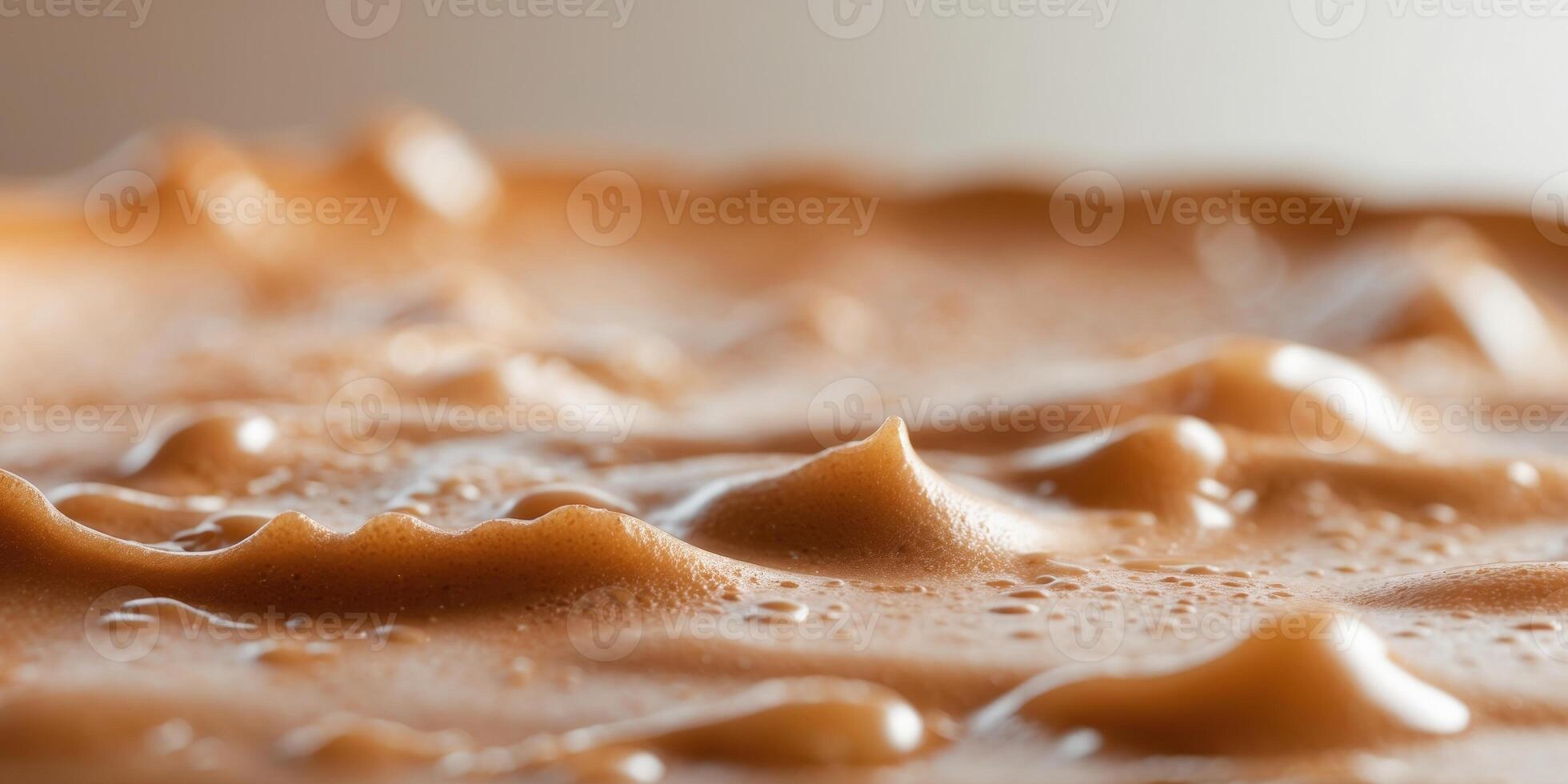 Extreme closeup of creamy coffee foam in brown tones. photo