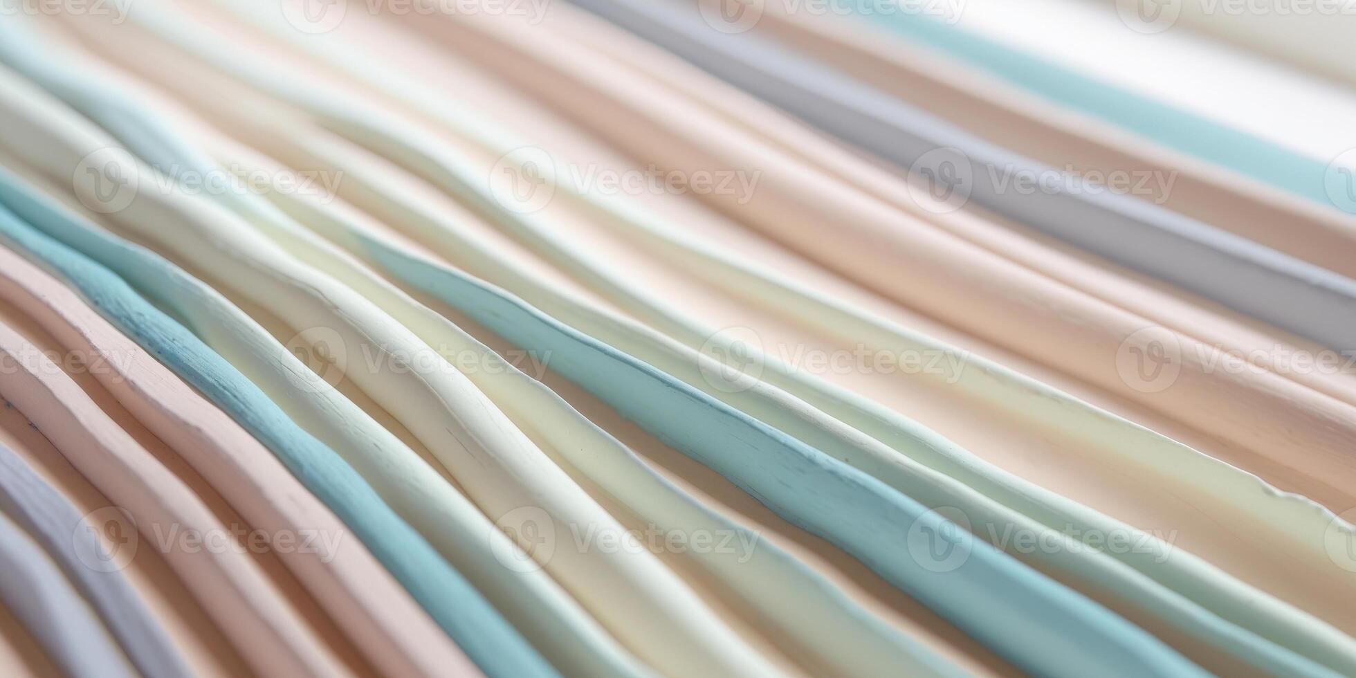 Pastel colored clay stripes creating a textured background. photo