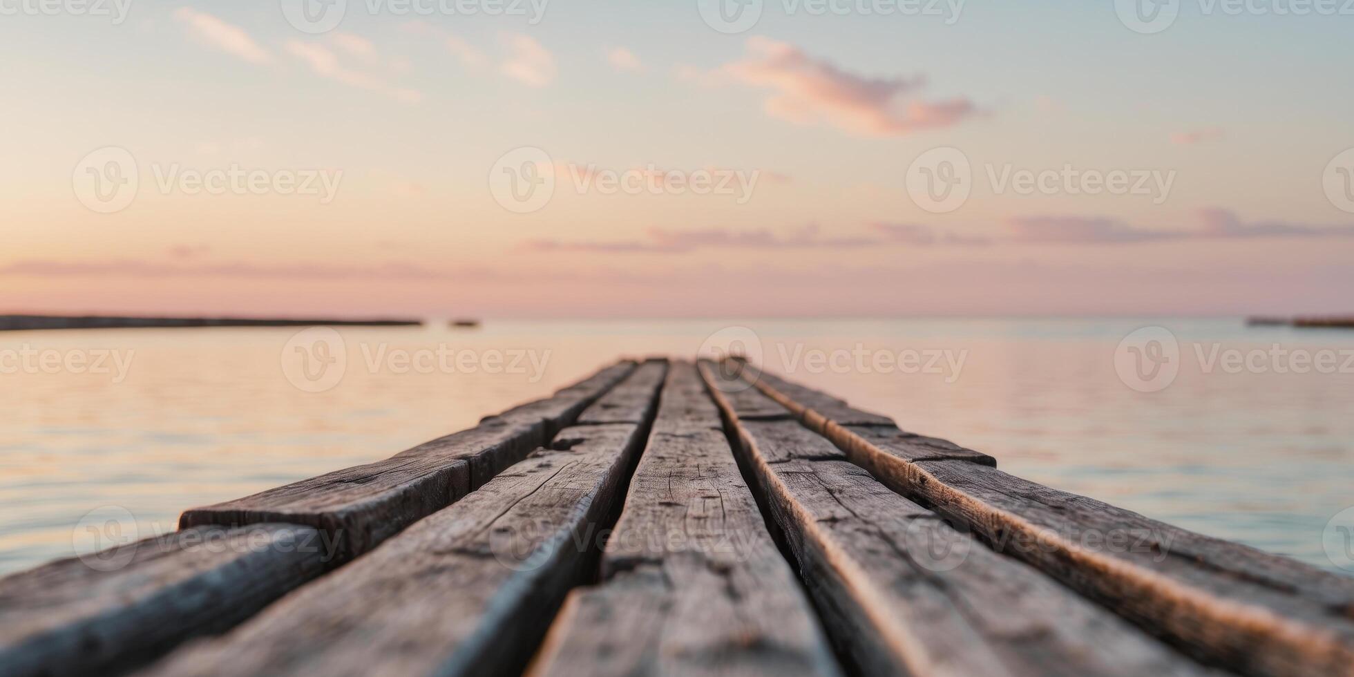 Old Wooden Pier Stretching Out Into Calm Sea at Sunset with Beautiful Colors in the Sky. photo
