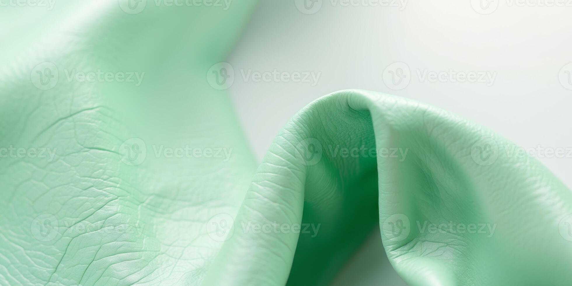 Mint green leather texture with subtle wrinkles and light gradient for backgrounds or designs. photo