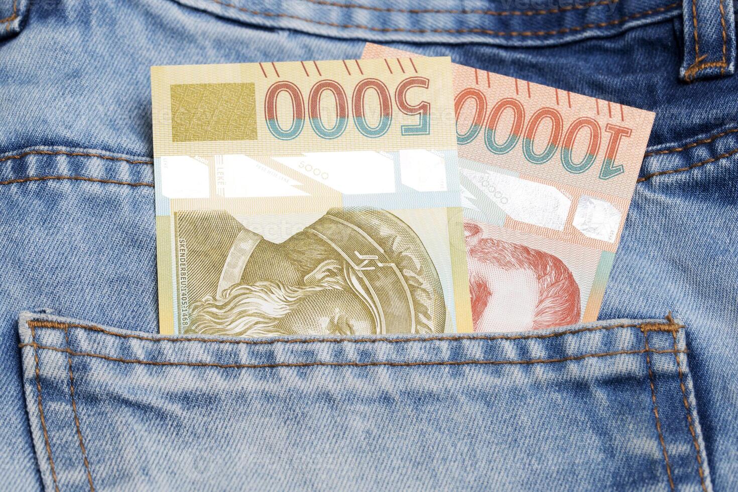 Albanian money - Lek in the pocket of blue jeans photo