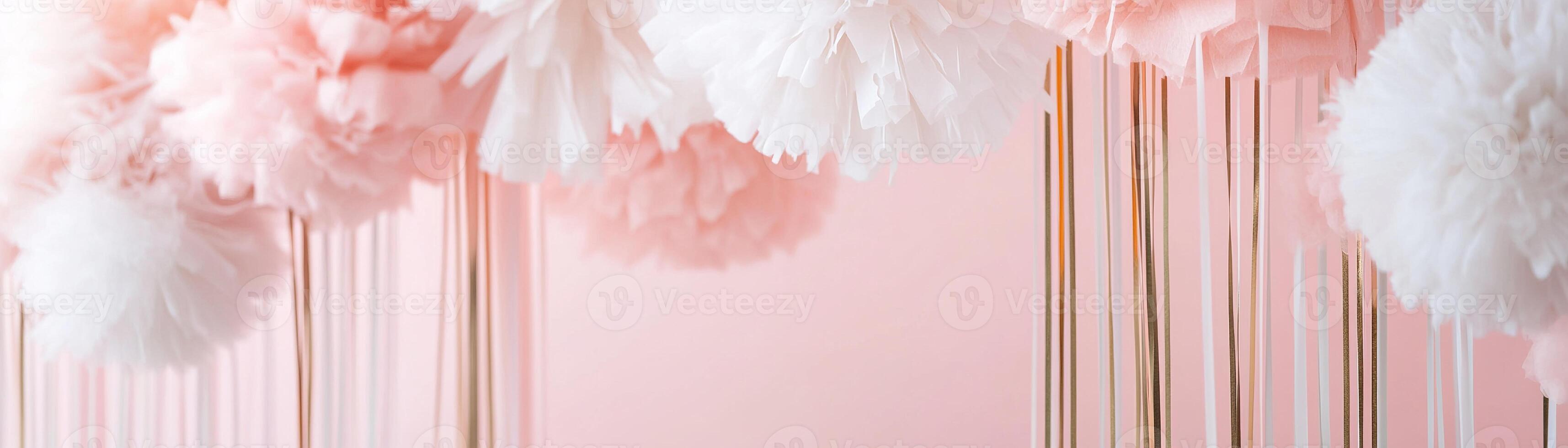 A pastel pink backdrop enhances the atmosphere with hanging streamers in white, gold, and blush tones, providing an elegant space ideal for text or decoration at any celebration photo