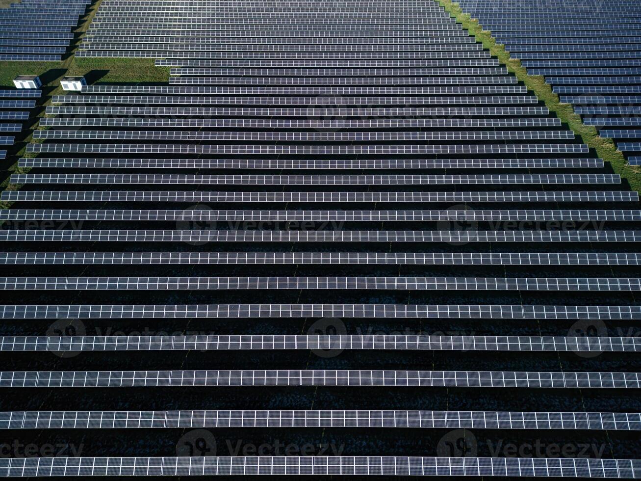 large solar power plant in northern Germany. Despite the weather, the solar power plant produces enough clean energy, new environmental standards, drone view of solar panels, solar farm photo