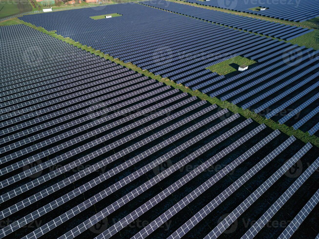 large solar power plant in northern Germany. Despite the weather, the solar power plant produces enough clean energy, new environmental standards, drone view of solar panels, solar farm photo