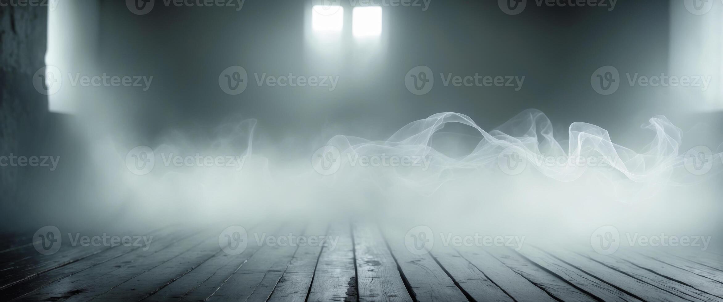 Mist drifts across a wooden floor creating a mysterious atmosphere in a dimly lit space. photo