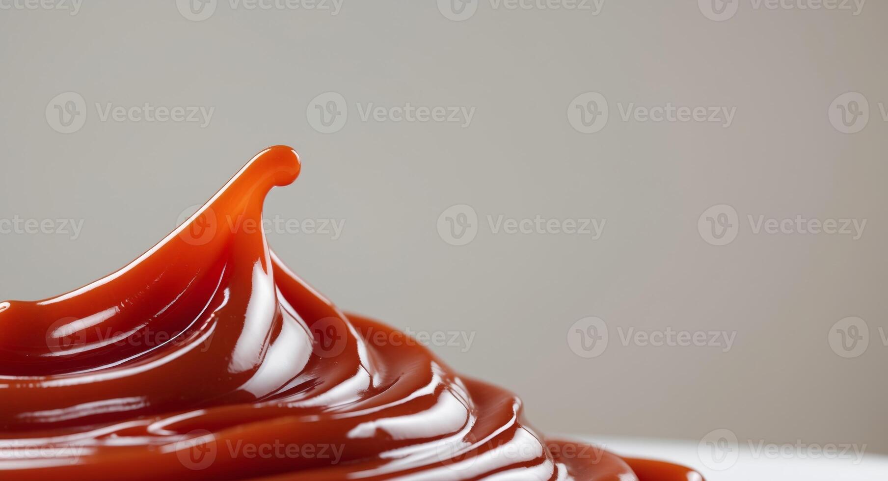 close up view of smooth glossy ketchup with wavy texture. photo