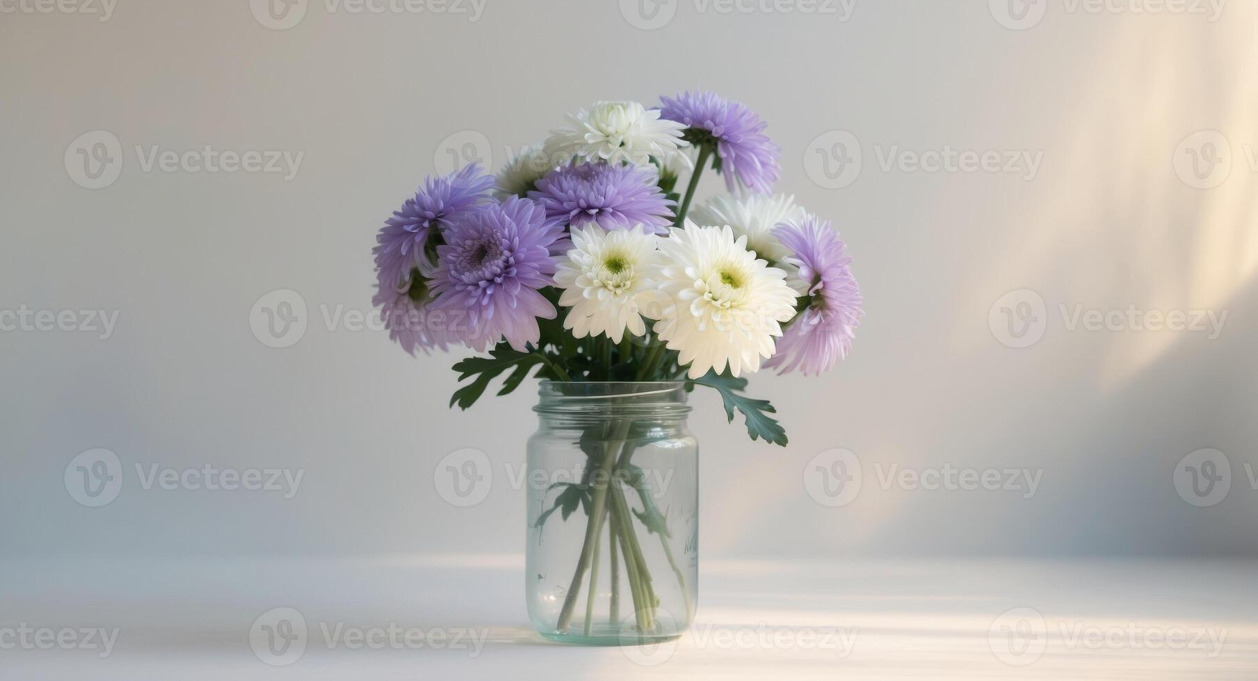 Bouquet of Purple and White Chrysanthemums in a Glass Jar. photo