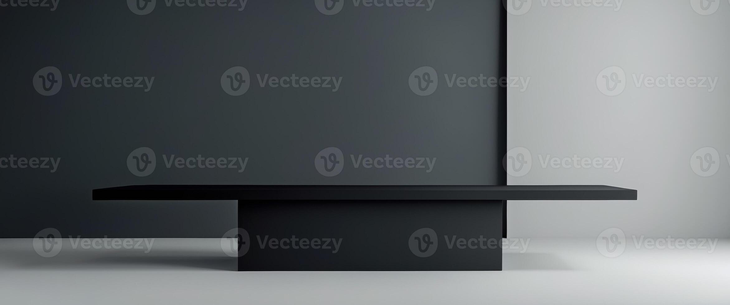 Black podium or pedestal display on dark background with long platform. photo