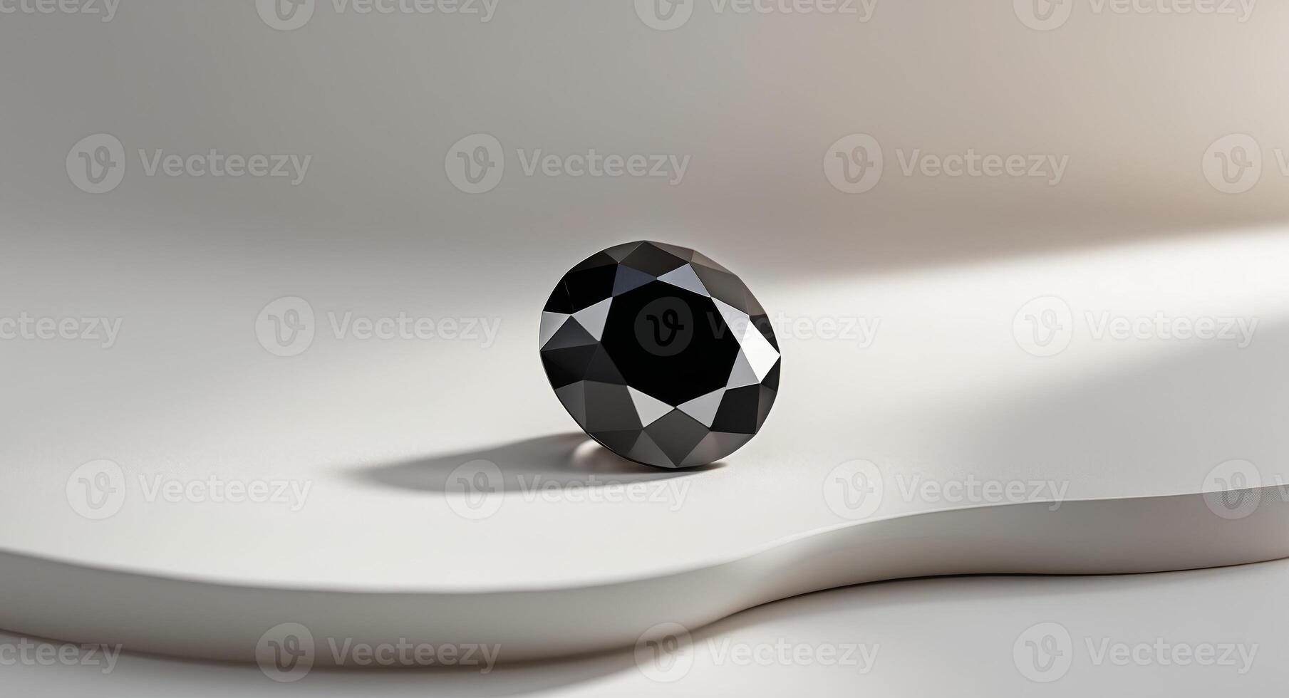 A Single Black Diamond Resting On White Surface photo