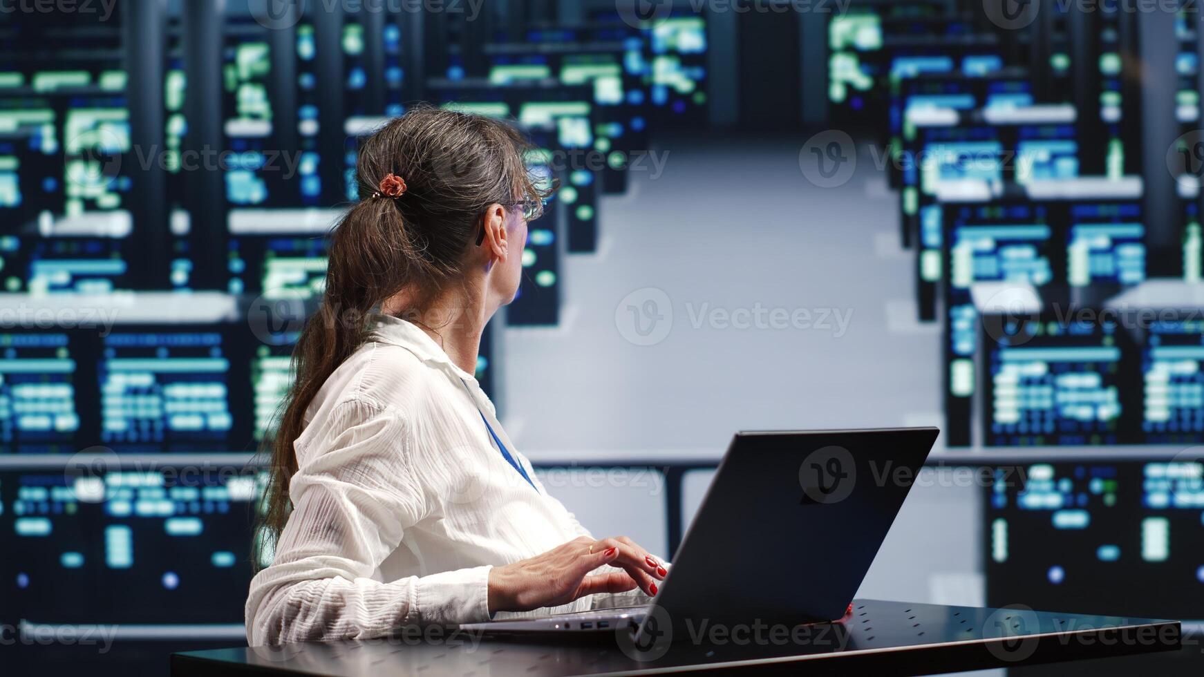 Capable repairman in cloud computing business equipped to handle complex computational operations, doing regular upgrades to supercomputers, increasing processing power to prevent perils photo
