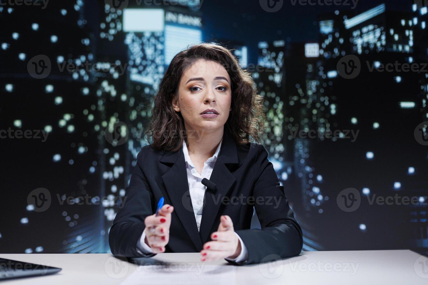 Journalist discussing about latest news, creating newscast reportage for viewers transmitting live information. Filming in studio, presenter hosting night show discussing about interesting events. photo