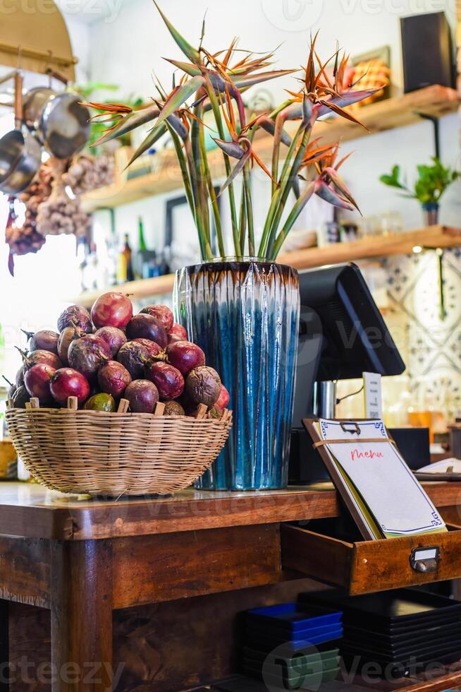 Loft design of interior with passion fruit and decor near cashier counter and menu photo