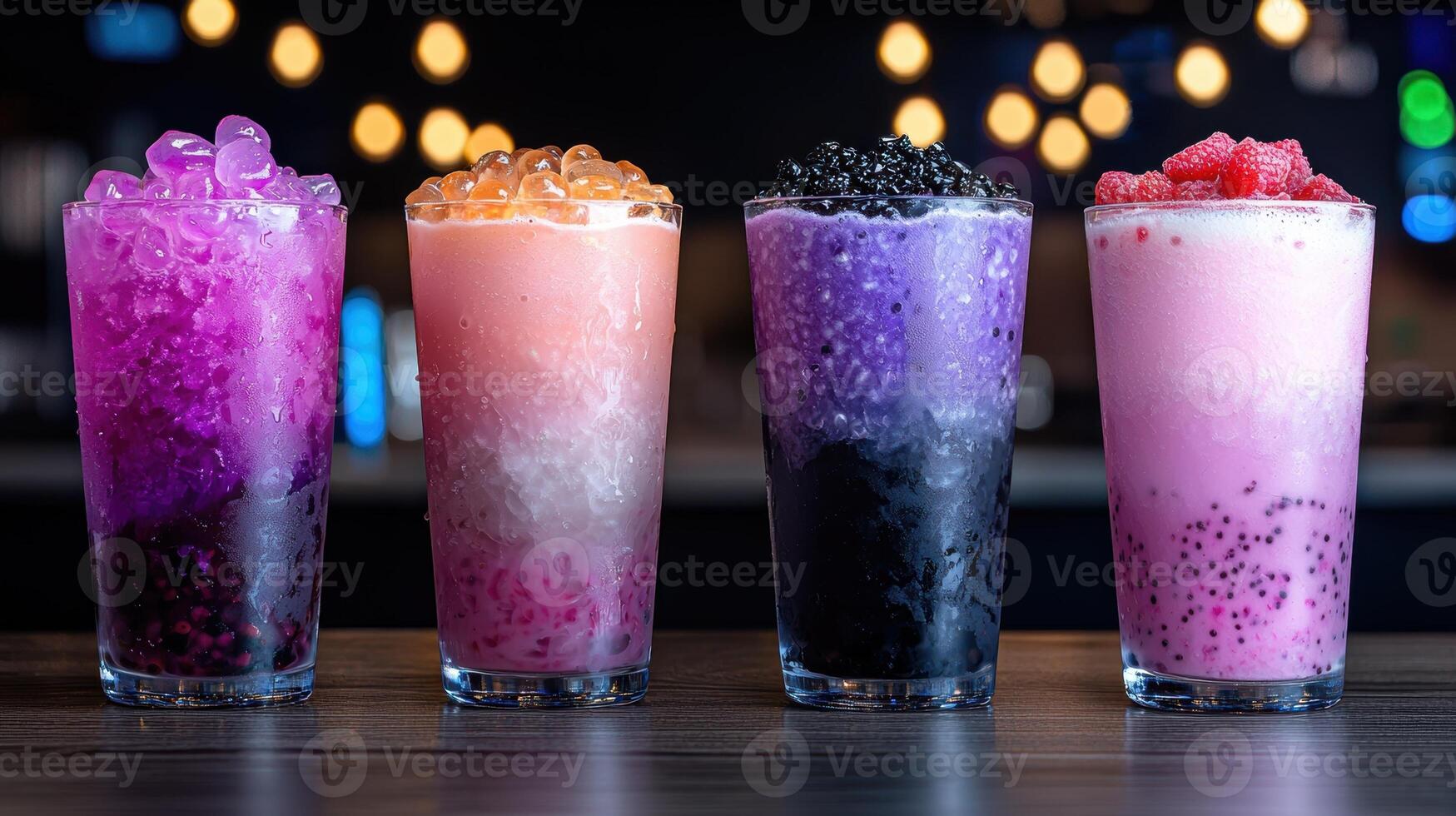 Four colorful bubble tea drinks with tapioca pearls photo