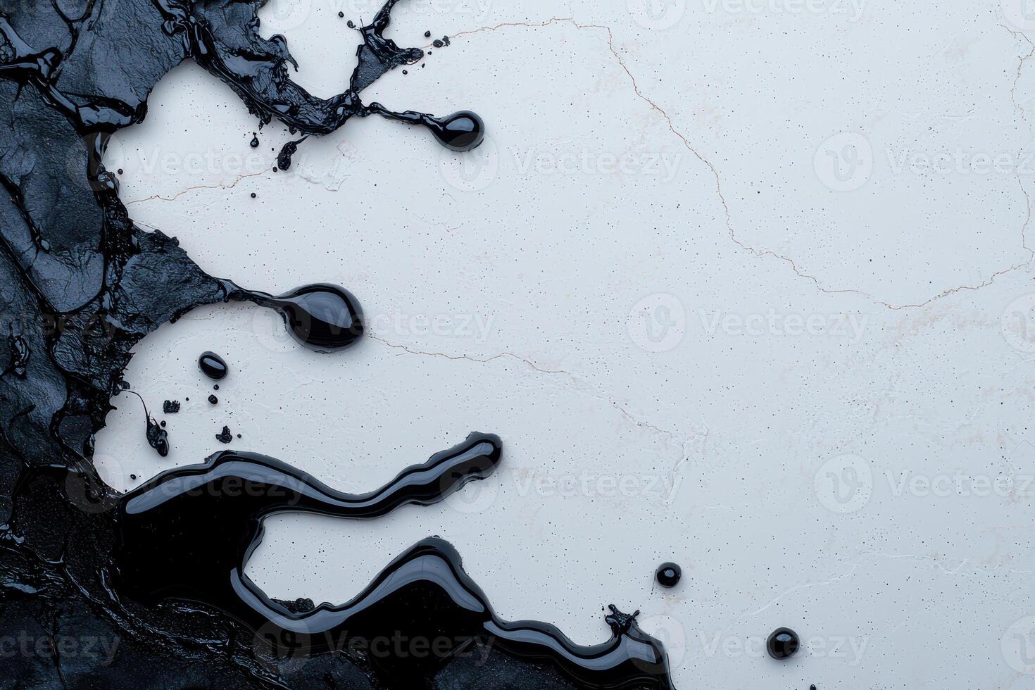 Abstract black paint splatters on a white textured background photo