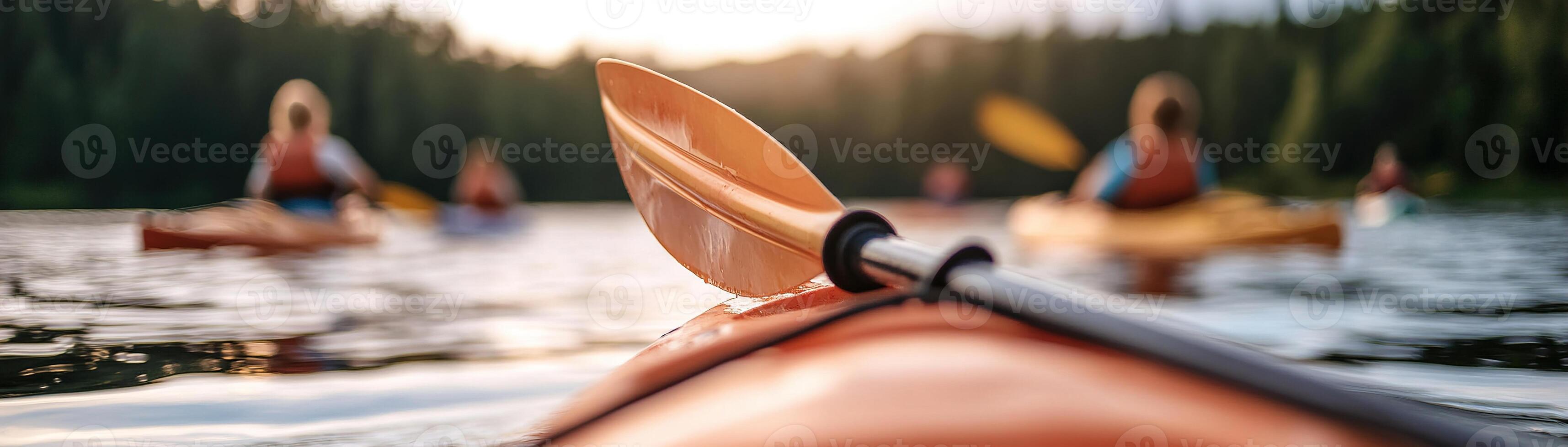 Children paddle on brightly colored kayaks and paddleboards in a tranquil lake. Soft light bathes the scene, with blurred mountains and forests enhancing the natural beauty photo