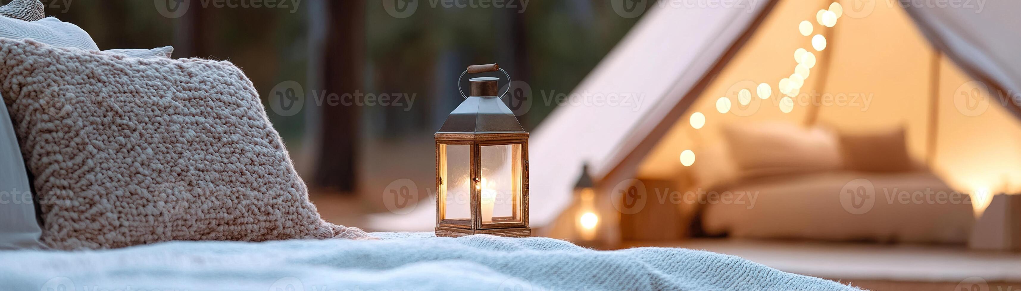 Luxury tents offer plush bedding, fairy lights, and stylish rugs, creating an inviting outdoor atmosphere with blurred trees and lanterns. Enjoy a unique glamping getaway photo