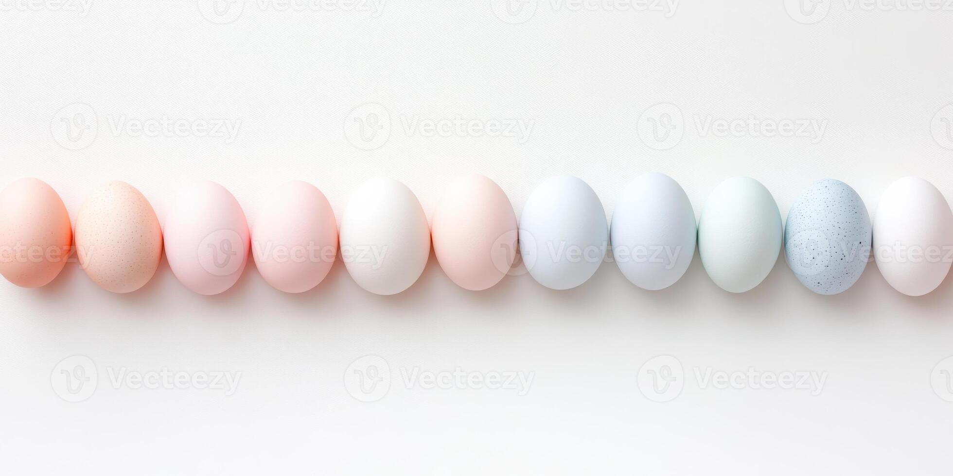Pastel-colored eggs arranged in a row against a light background photo