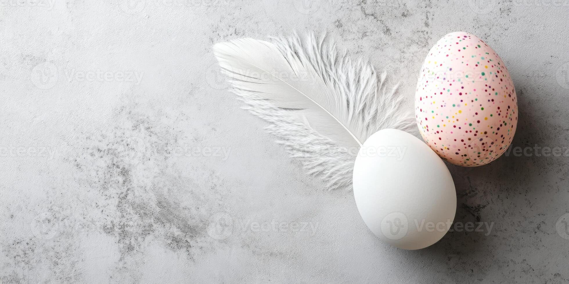 Two decorative eggs with feather on textured background for easter holiday theme photo