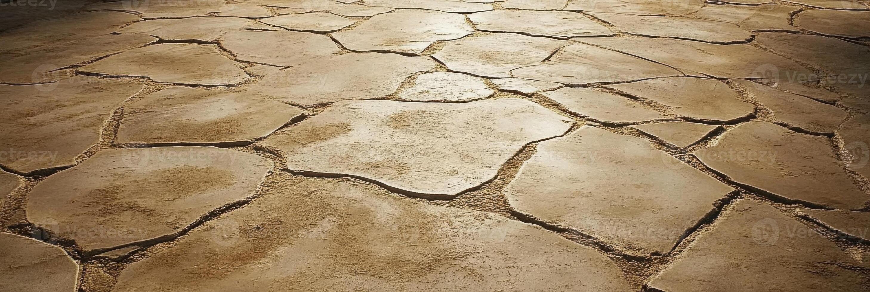 Sunlit stone tiles with natural cracks in earthy tones for flooring concept photo
