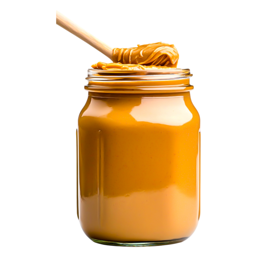 Creamy Peanut Butter in Glass Jar with Spoon on Wooden Surface png