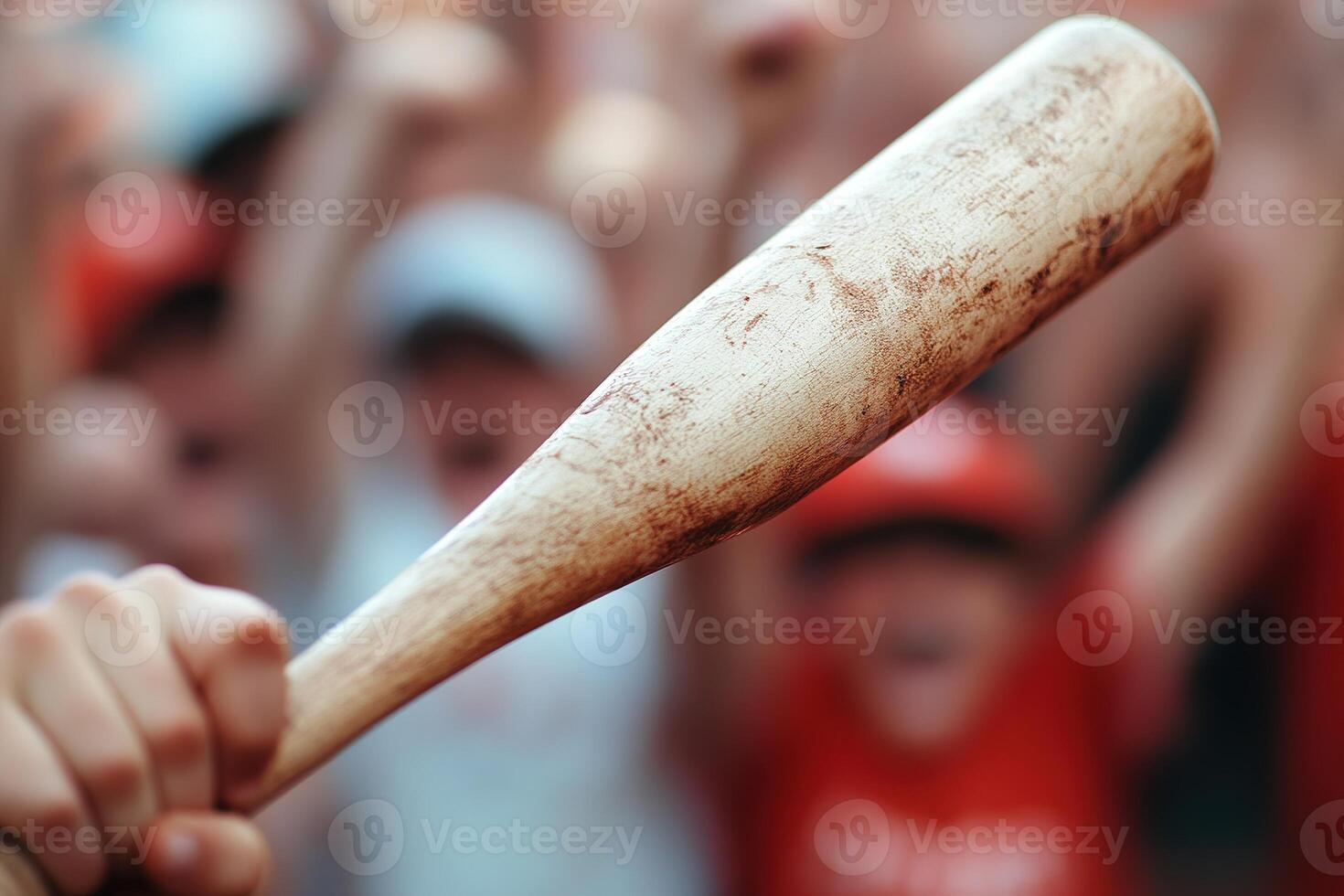 Excitement fills the air as a child swings a baseball bat, putting all their energy into the hit. Teammates cheer joyfully in soft focus, creating a vibrant atmosphere of camaraderie photo