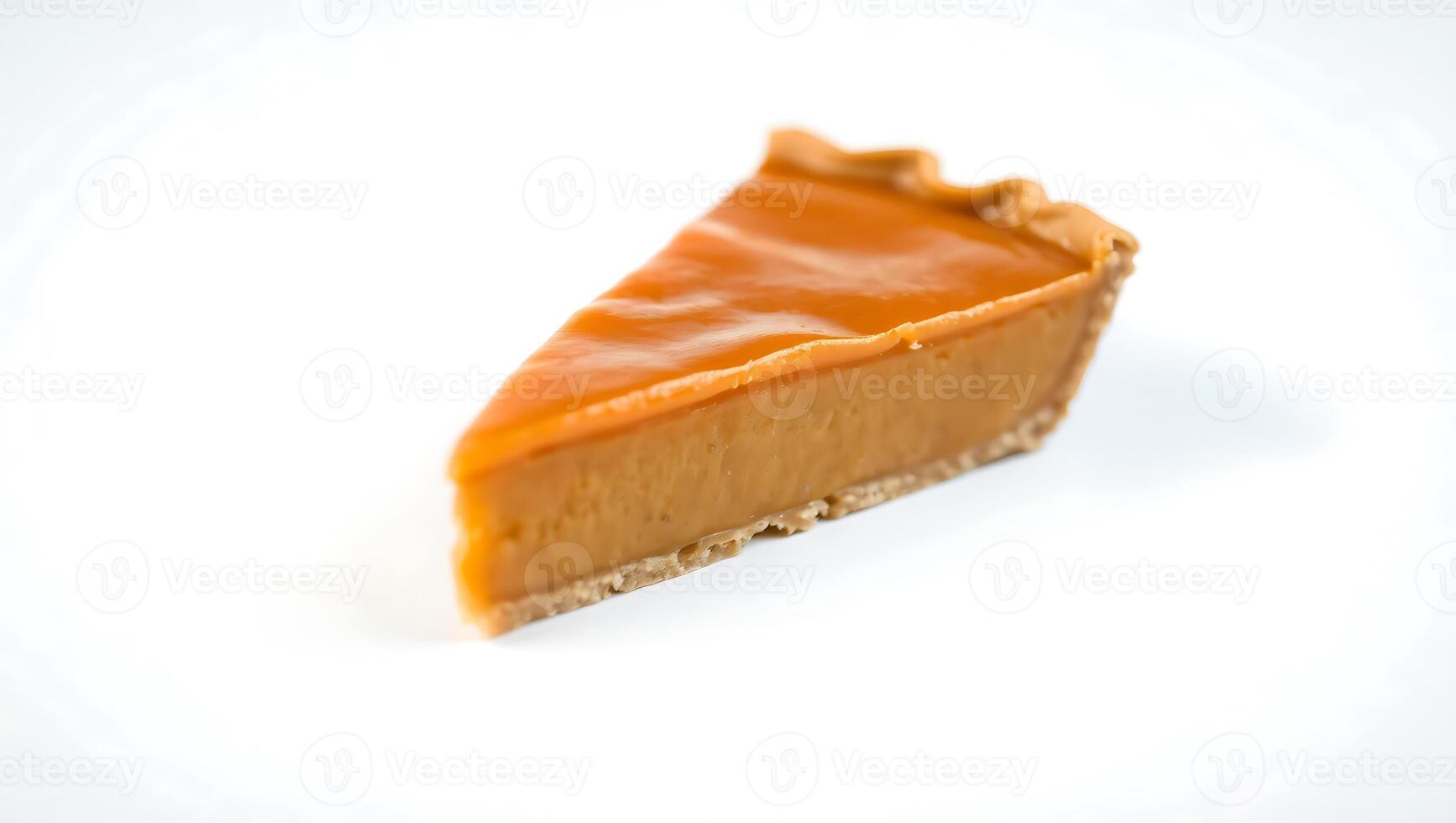 Slice of pumpkin pie on a plain background ready for dessert photo