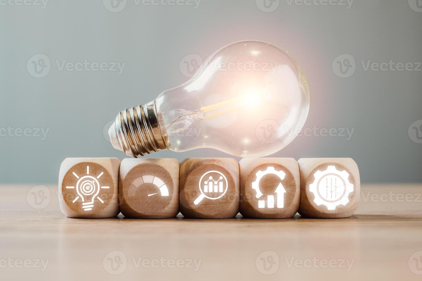 Creative representation of Six Sigma with light bulb and gear icons symbolizing quality management and process improvement. photo