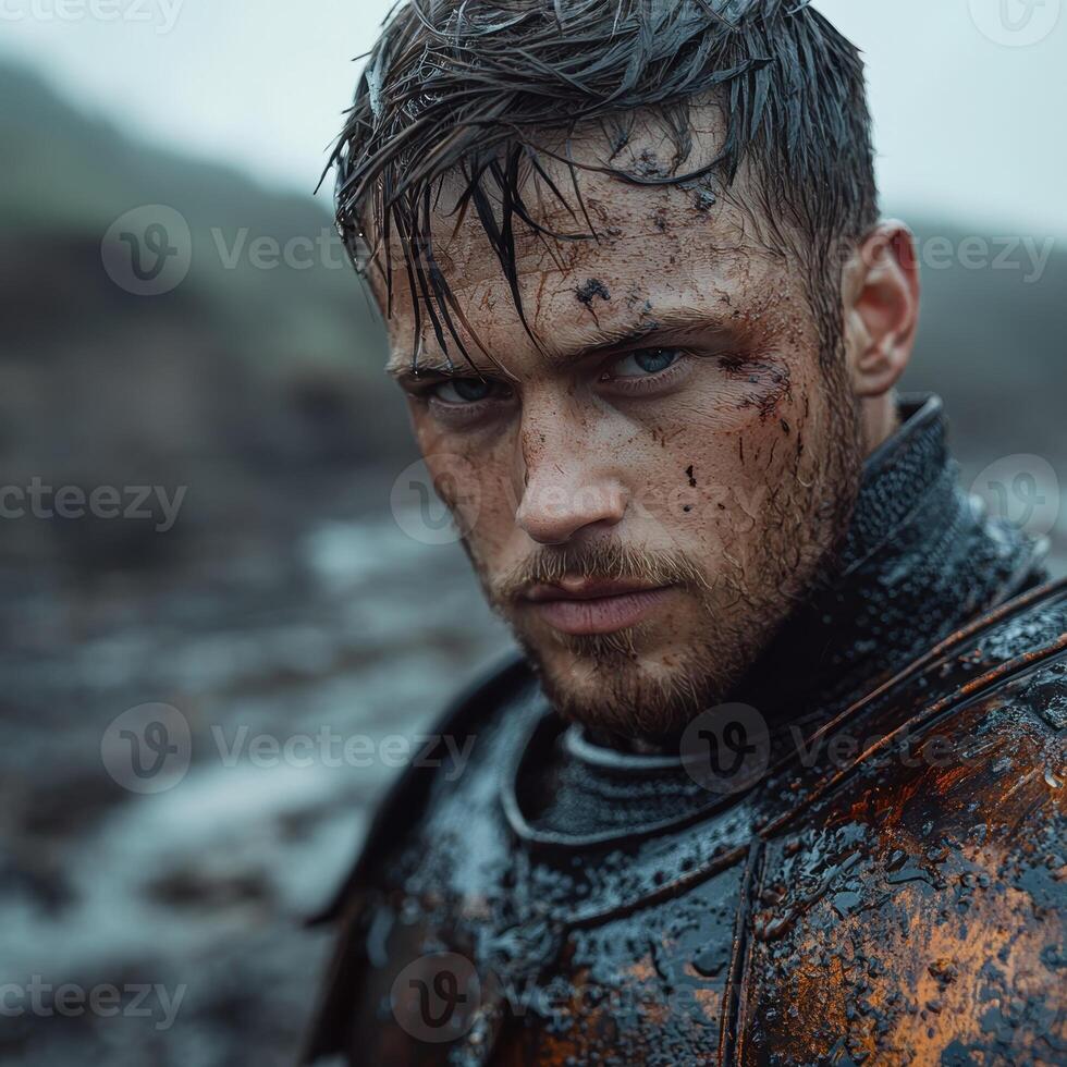 A determined warrior with battle scars and wet hair stares intensely photo