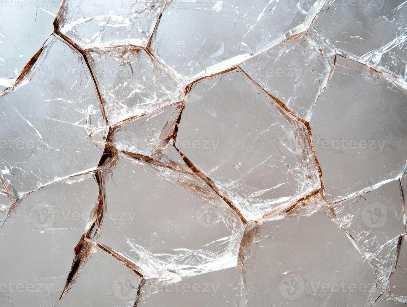 Cracked glass background with sharp edges photo