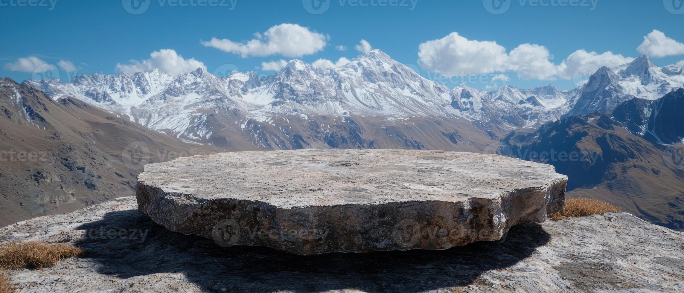 A stone platform overlooks a mountain range photo