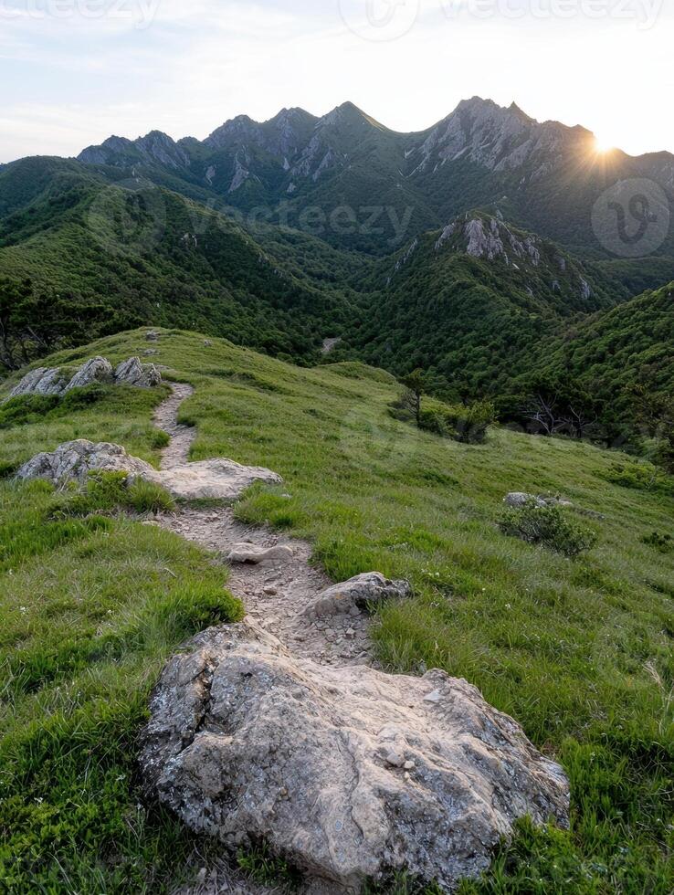 Scenic mountain trail at sunset photo