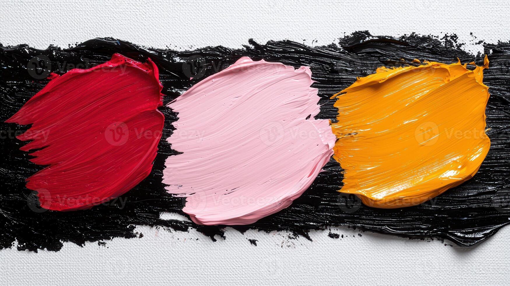 Abstract painting with red, pink, and yellow paint strokes on a black background photo