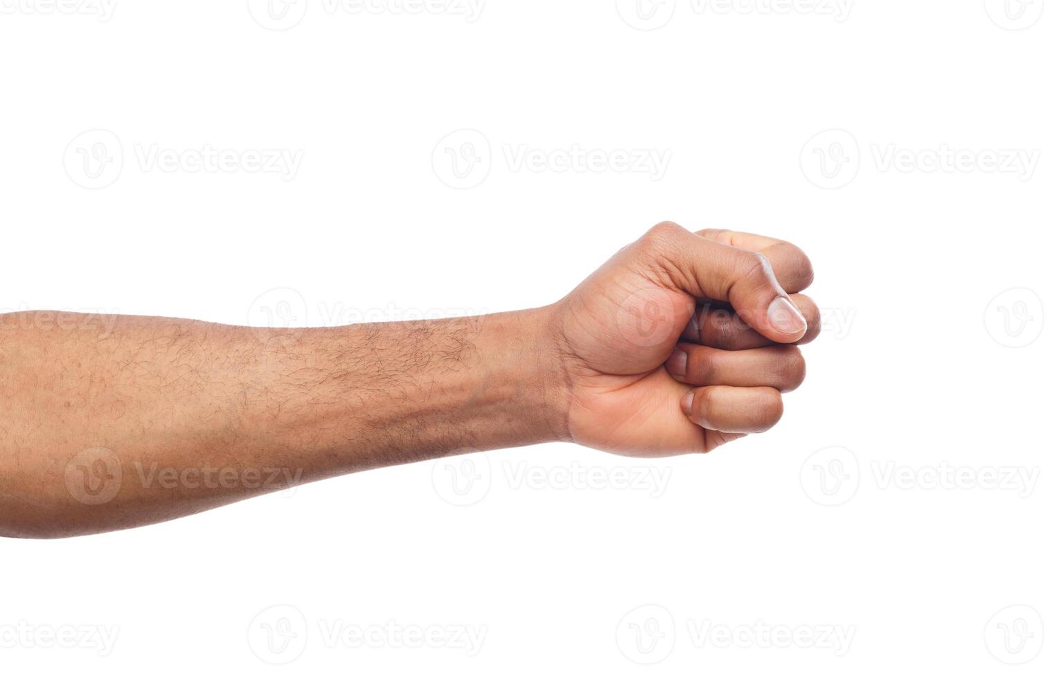 Male black fist isolated on white background. African-american clenched hand, gesturing up. Counting, aggression, brave, masculinity concept photo