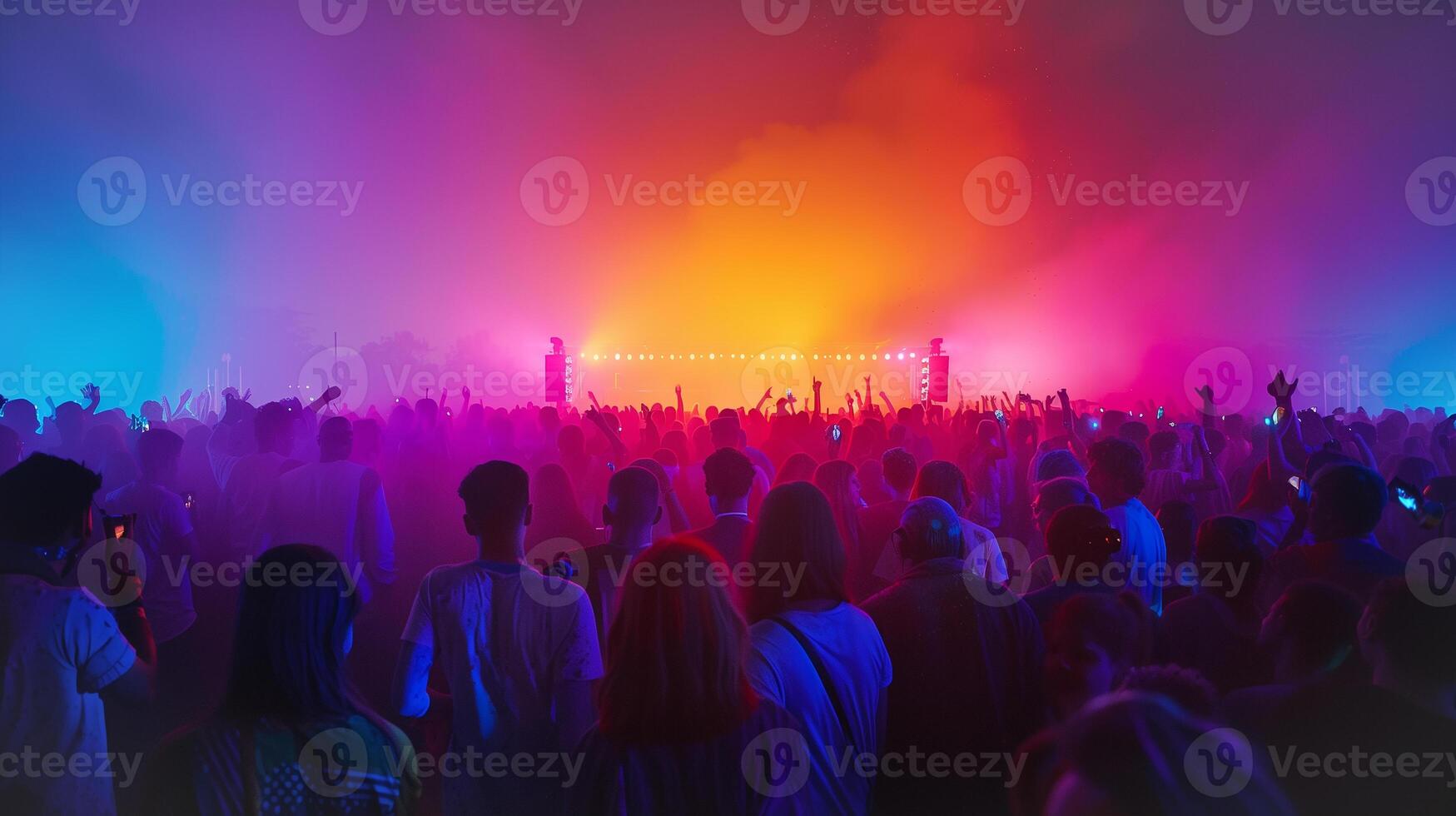 This People gather at a colorful festival celebrating Holi, enjoying music, dancing, and joyous moments. photo