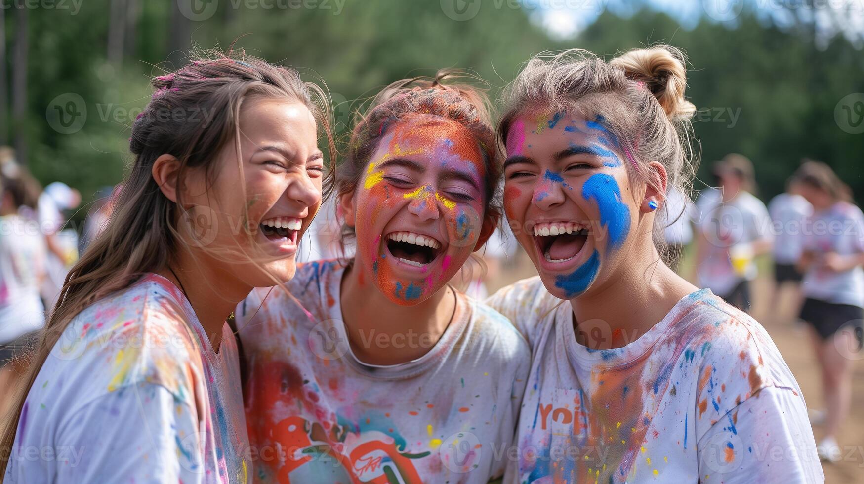 This Friends celebrate Holi festival, laughing and drenched in colorful powders under a sunny sky. photo