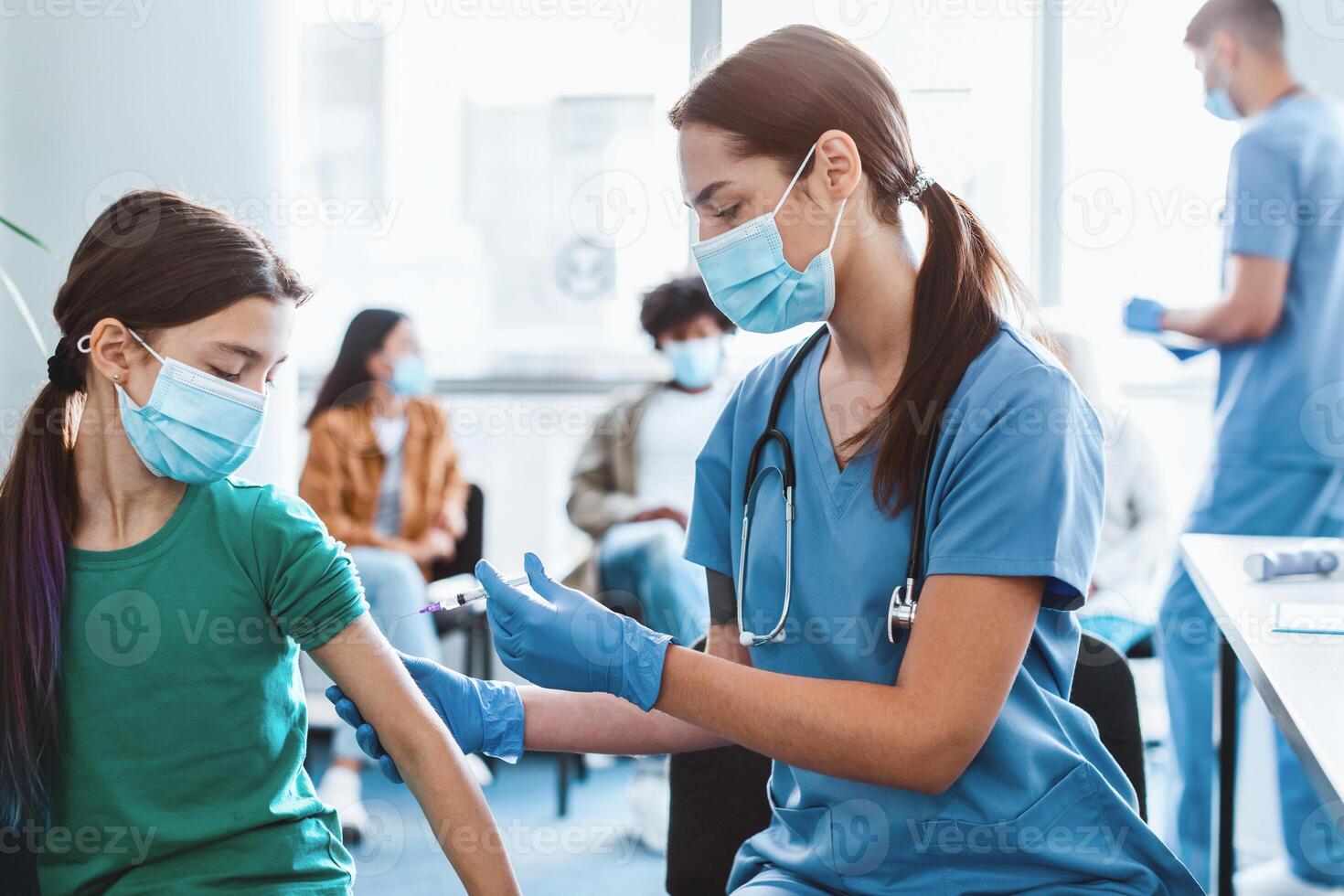 Doctor holding syringe making covid 19 vaccination injection dose in shoulder of little patient. Flu influenza vaccine clinical trials concept, corona virus treatment side effect, inoculation photo