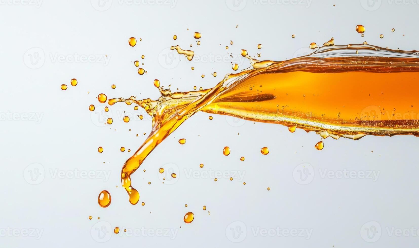 Golden honey splashes create an eye-catching display as they are poured, showcasing the rich, luscious texture. The vibrant liquid contrasts beautifully with the clean backdrop. photo