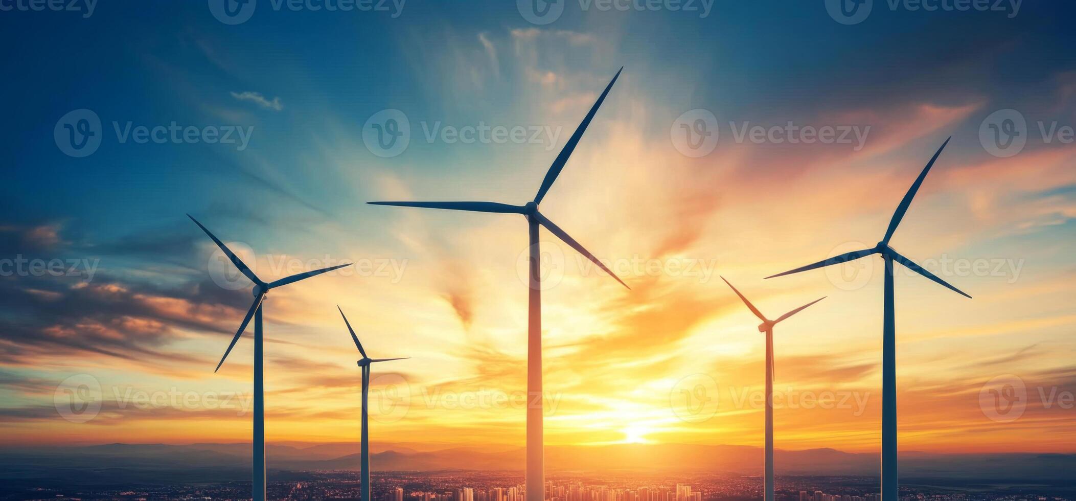 Wind turbines rise against a dramatic sunset, with golden rays illuminating the sky. This renewable energy source contributes to sustainable practices while showcasing nature's beauty. photo