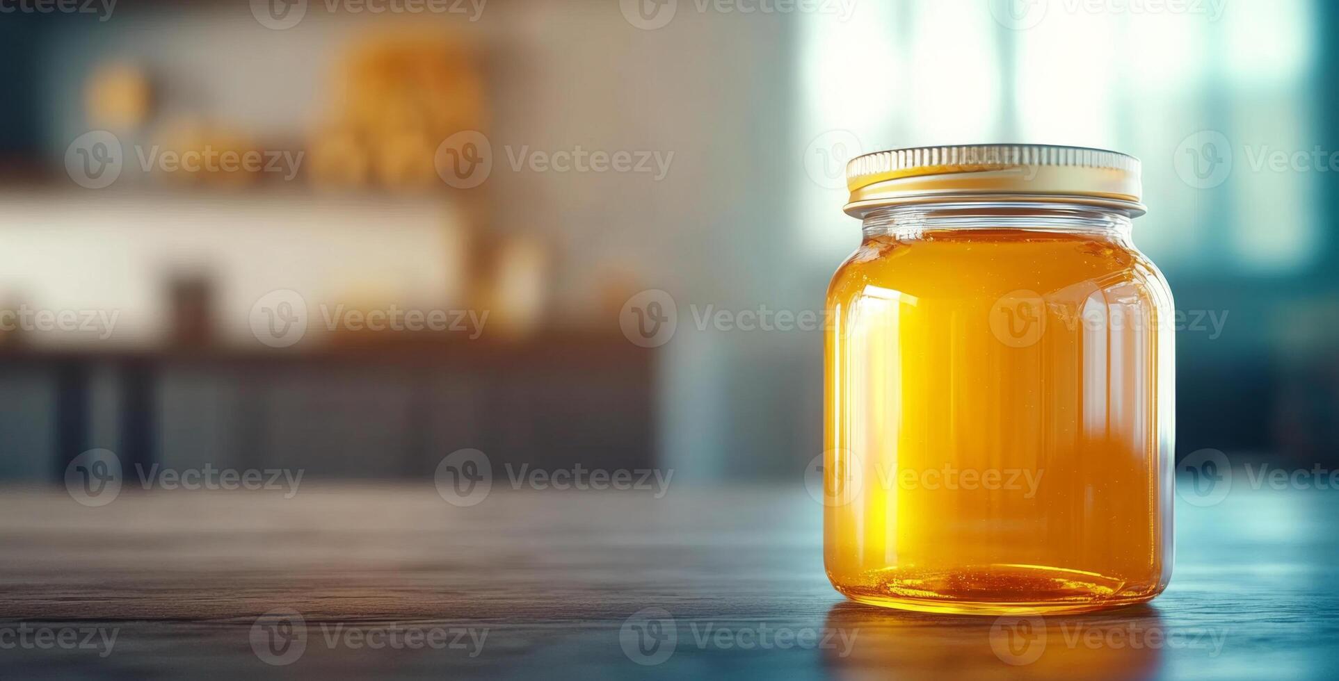 A jar of golden honey sits on a wooden table in a sunlit kitchen, emphasizing the beauty of organic beekeeping. The warm tones of the honey add richness to the rustic setting. photo
