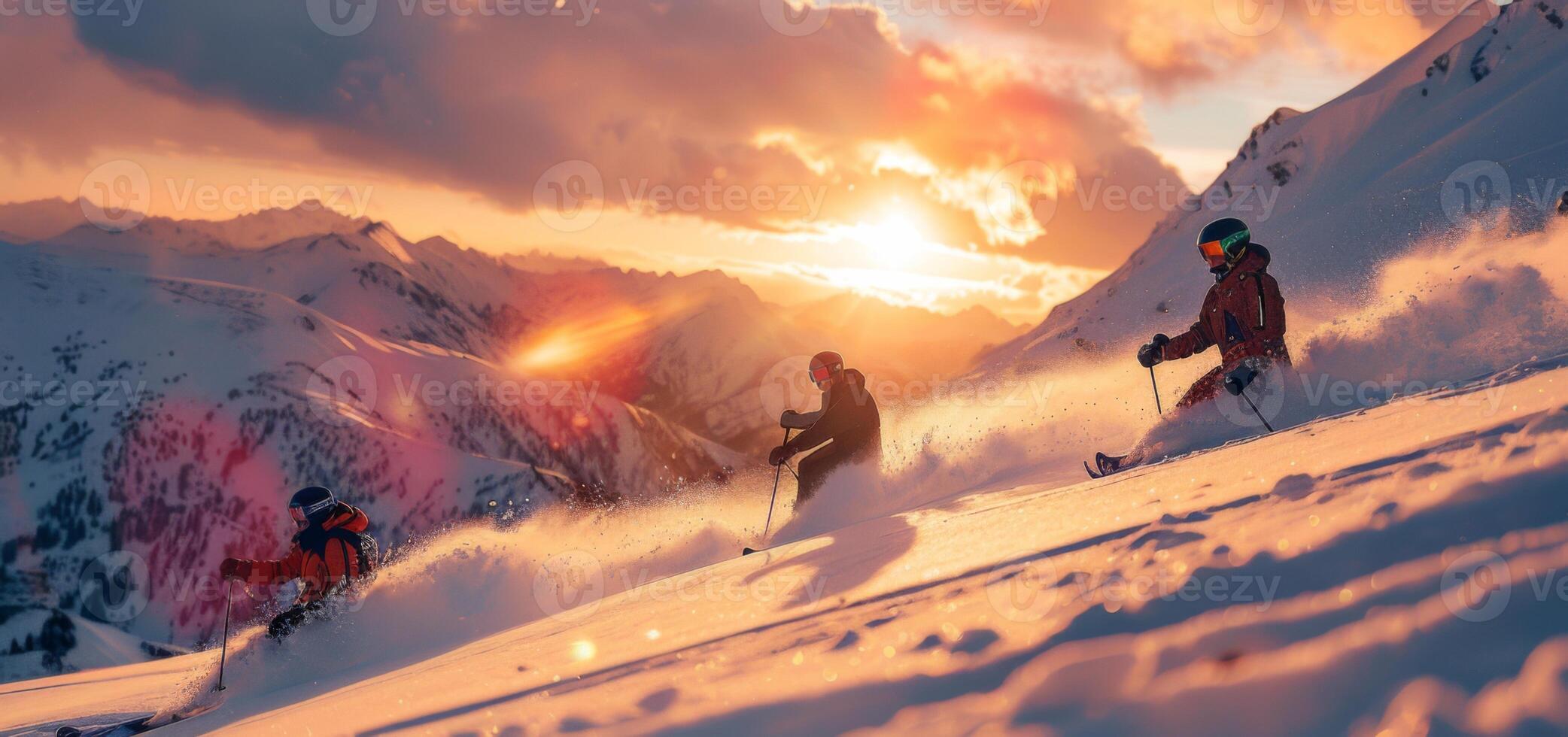 Three skiers navigate a snowy slope, kicking up powder as the sun sets behind the majestic mountains, illuminating the sky with warm hues of orange and pink. photo