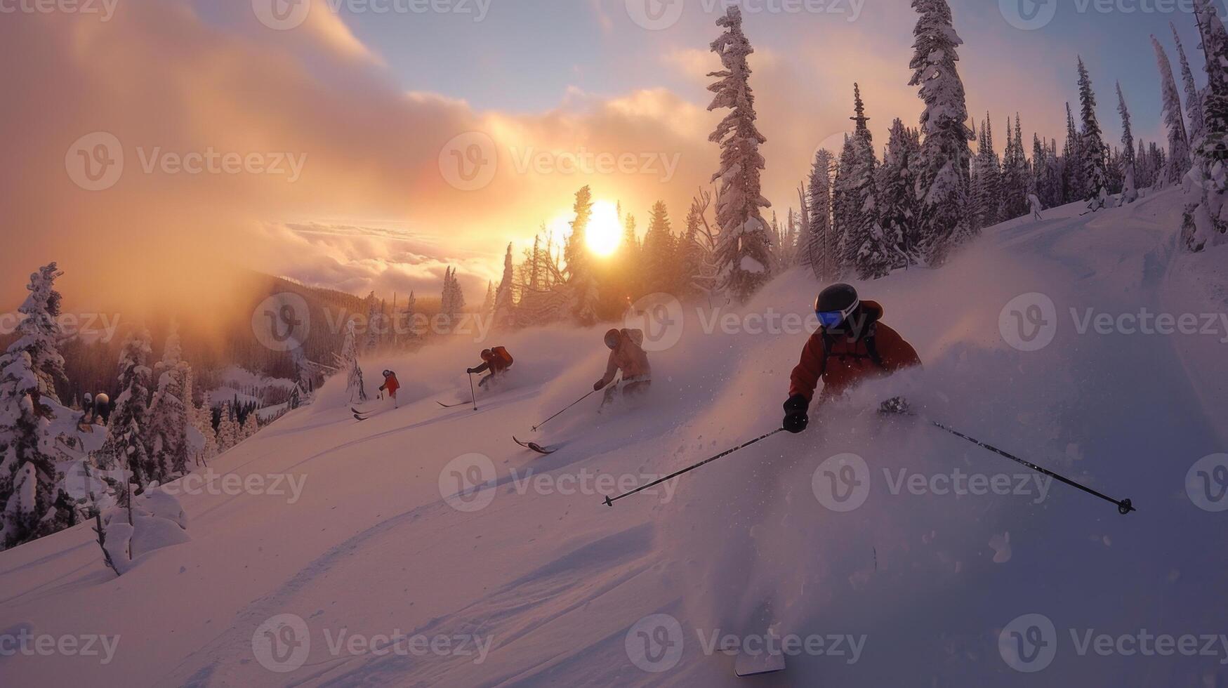 Skiers glide down a snowy slope surrounded by tall trees, enjoying a stunning sunset. The scene captures the joy of winter sports and the beauty of nature's colors. photo