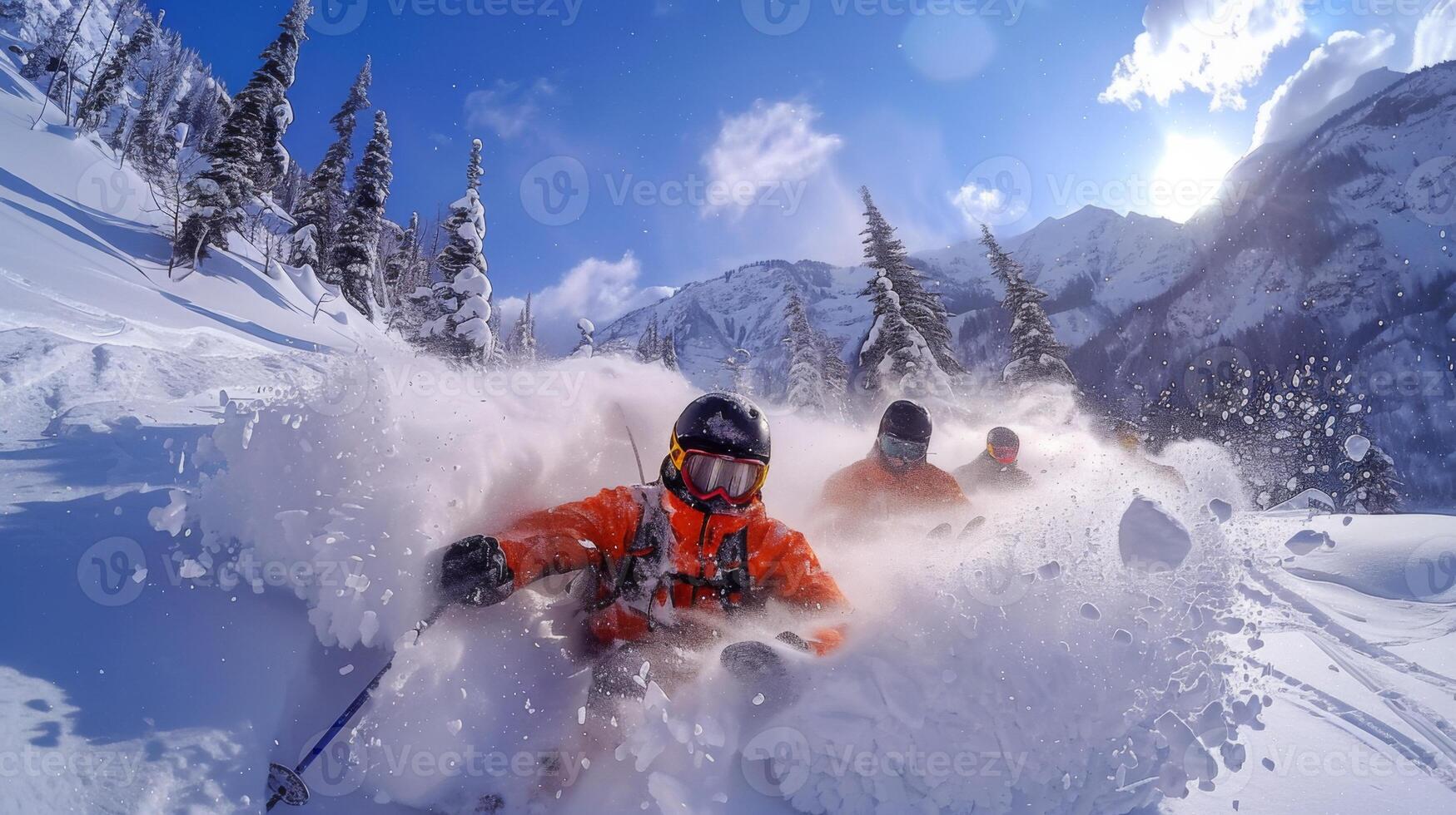 Three skiers are capturing the thrill of fresh powder as they carve through deep snow, surrounded by majestic mountains and a clear sunny sky. photo