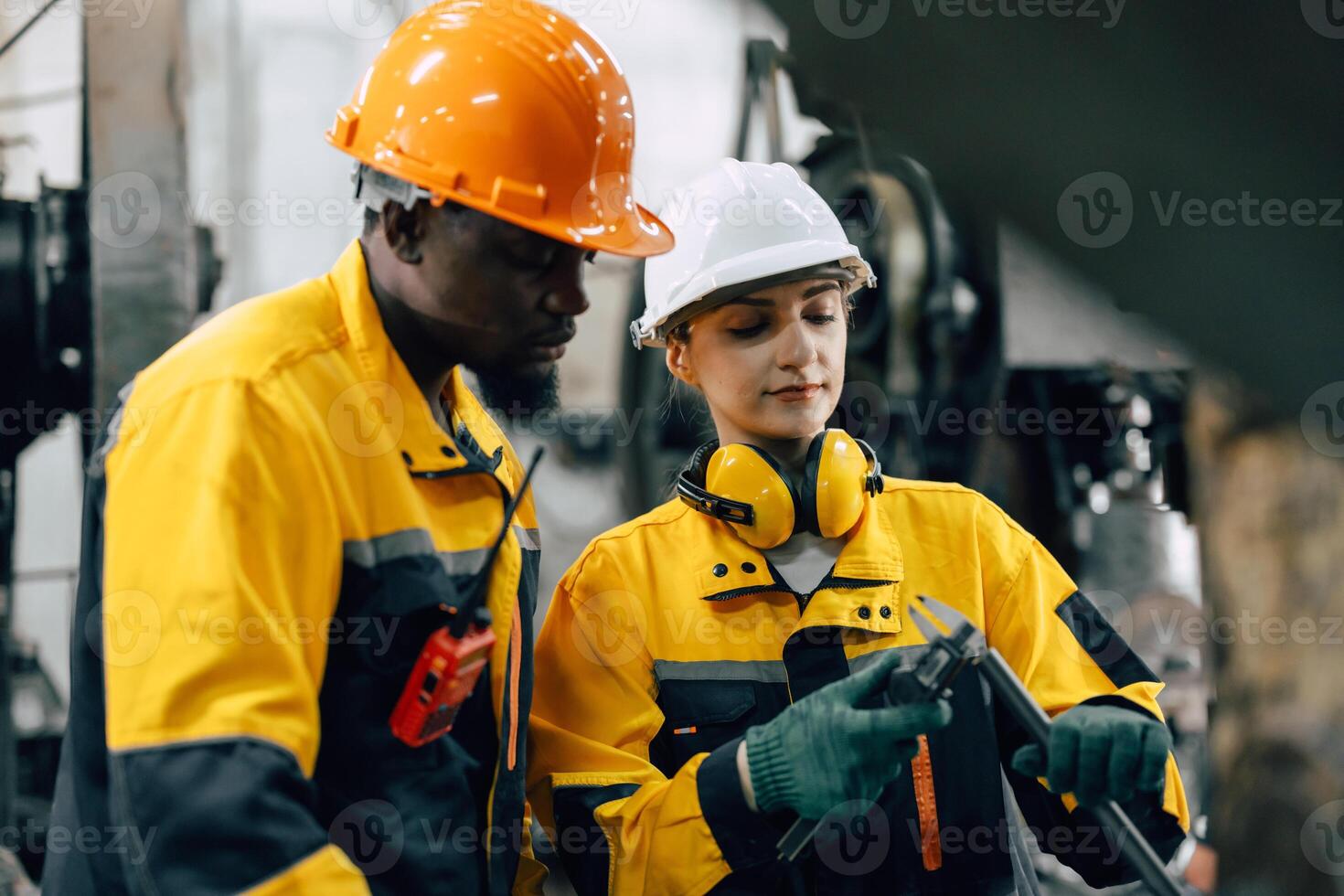 professional engineer team checking product quality control in metal workshop production line photo
