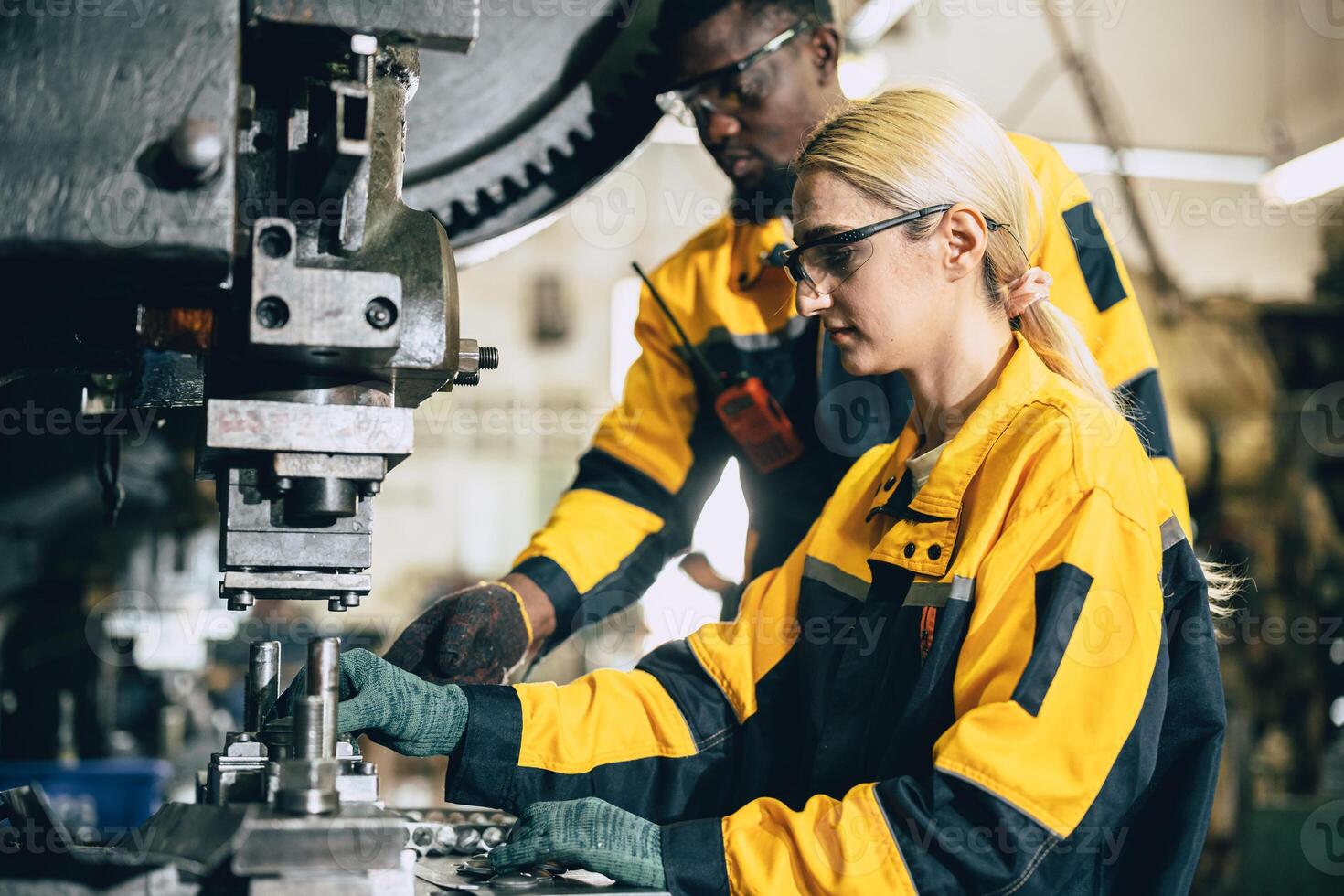 team working in heavy metal industry factory training inspector quality control in production line photo