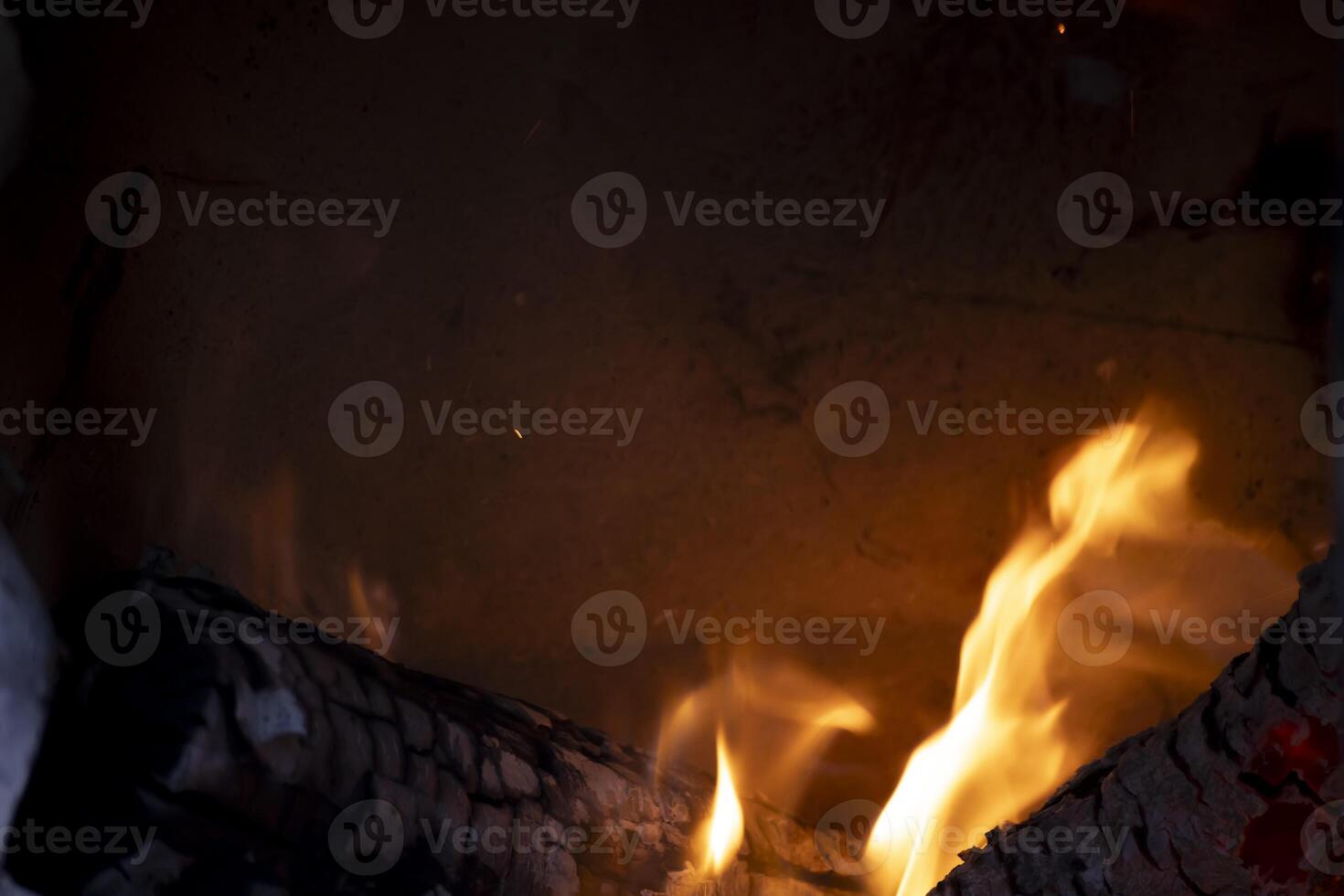 A burning flame with charcoals in the stove photo